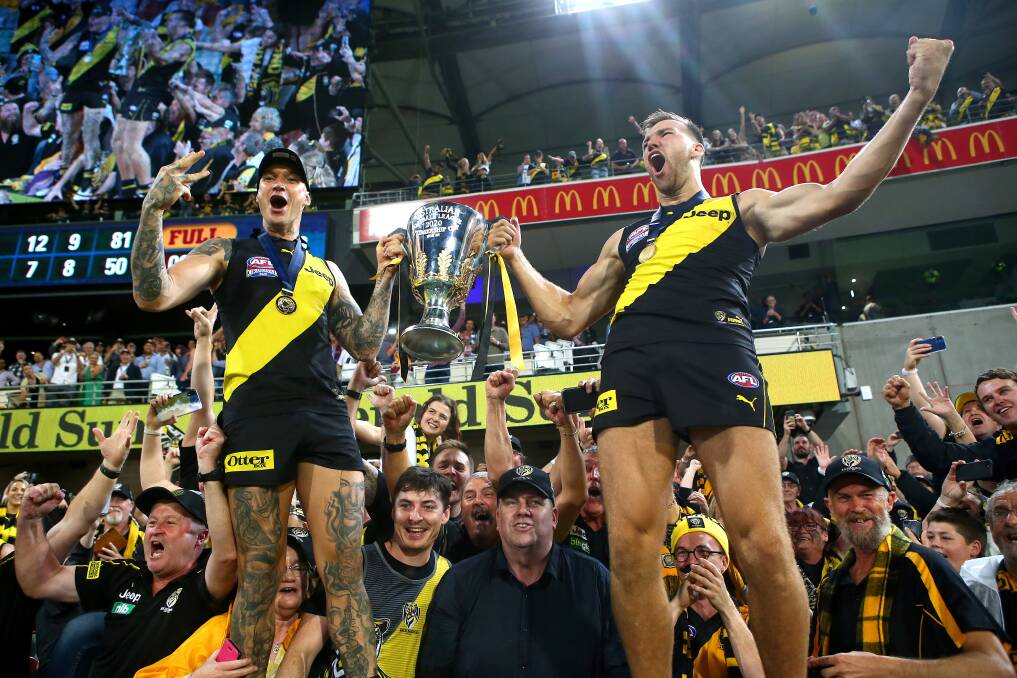 Dustin Martin celebrates Richmond's grand final win with team-mate Noah Balta. Picture: GETTY IMAGES
