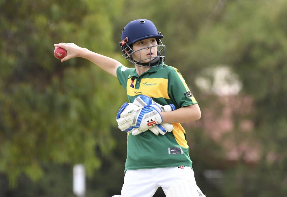 SAFE HANDS: Kangaroo Flat under-12 wicket-keeper Angus Diss. Picture: NONI HYETT