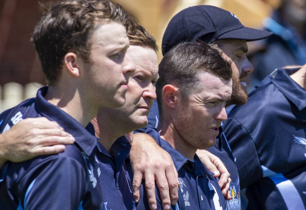 BROTHERS IN ARMS: Eaglehawk players support Anthony West. Picture: DARREN HOWE