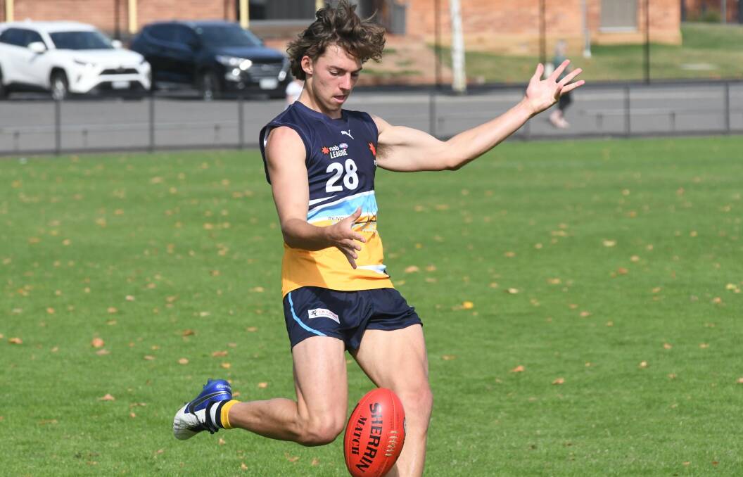 CRUCIAL KICK: Charlie Bennett boots the Bendigo Pioneers inside 50 in Sunday's clash with Dandenong.