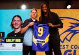 Harley Reid receives his number nine West Coast jumper from Eagles' great Nic Naitanui at the AFL National Draft. Picture by Getty Images