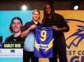 Harley Reid receives his number nine West Coast jumper from Eagles' great Nic Naitanui at the AFL National Draft. Picture by Getty Images
