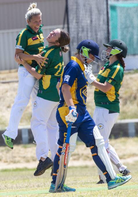 Kangaroo Flat players celebrate a key wicket in the grand final. Picture: DARREN HOWE