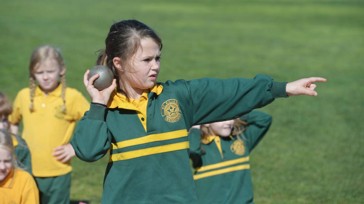Lila Keck in the shot put at her primary school sports in 2014. Picture by Bendigo Advertiser