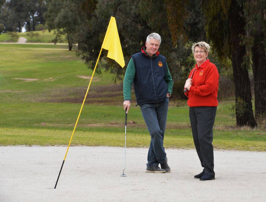 READY TO ROLL: Quarry Hill Golf Club president Stewart Davey and treasurer Sandra Davey ahead of this weekend's Victorian Sandgreen Championships. Picture: BRENDAN McCARTHY