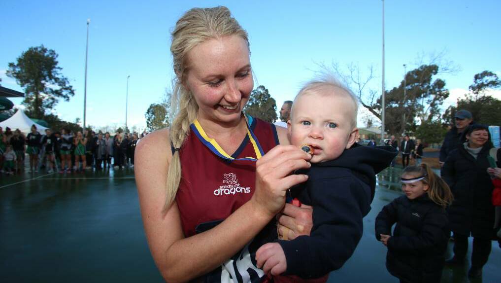Heather Oliver and son Theo after Sandhurst's 2019 netball premiership win.