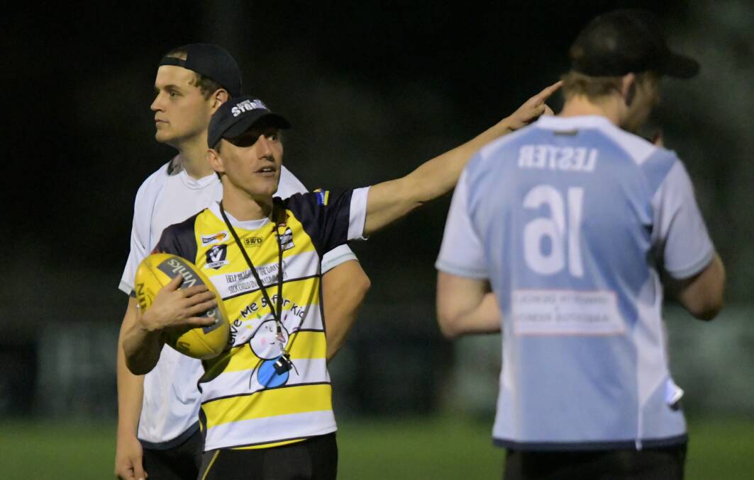 Storm coach Troy Coates gives his side instructions at training. Picture: NONI HYETT