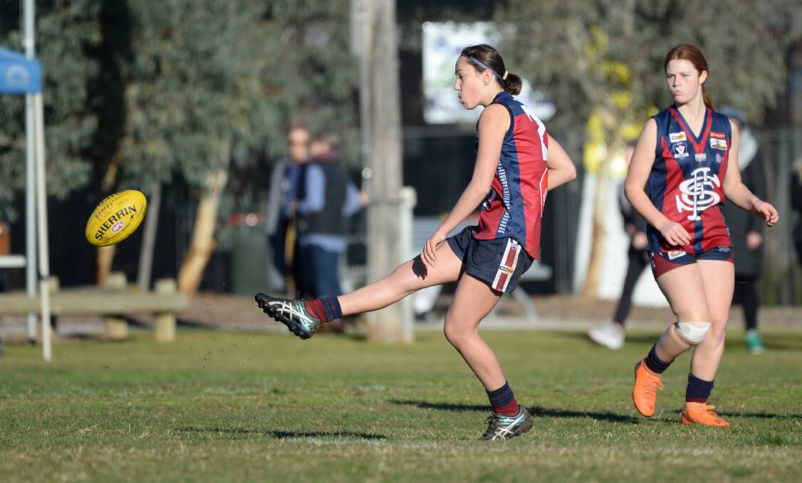 SKILLS: Sandhurst under-15 girls player Arkie Donnelly kicks the Dragons into attack.