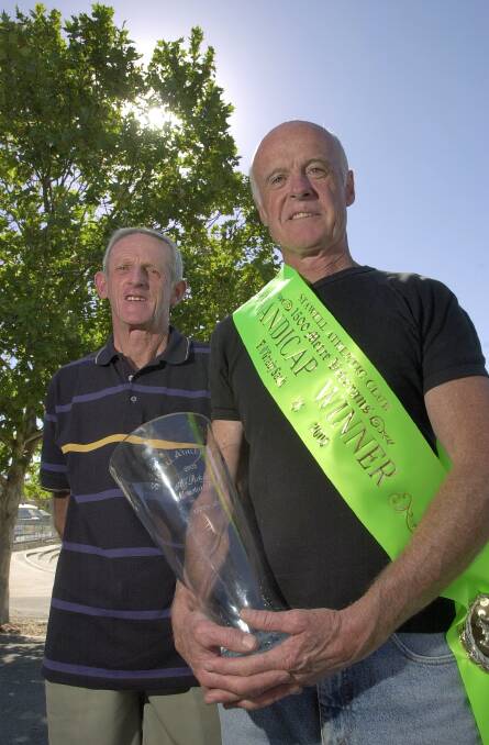 WINNING TEAM: John Burke with Steve Campbell in 2005. Burke coached Campbell to win the 1500m veterans event at the Stawell Gift carnival.