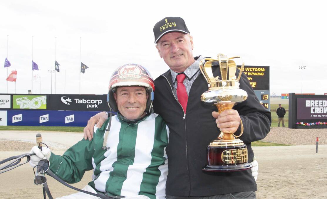 GROUP ONE GLORY: Driver Chris Alford and trainer Larry Eastman after Menin Gate's Breeders Crown victory at Melton. Picture: STUART McCORMACK