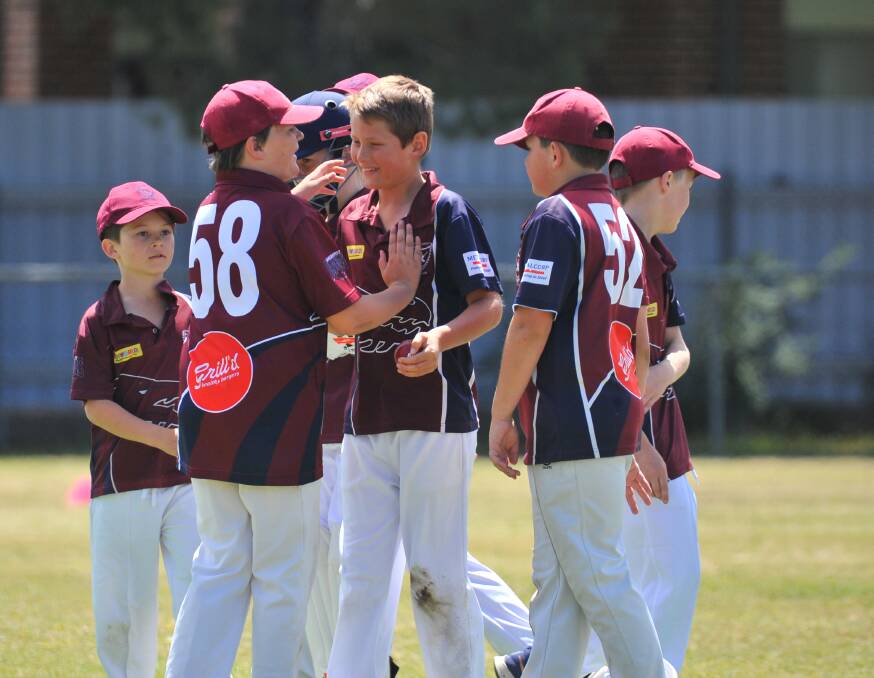 Sandhurst under-12A players celebrate a wicket against Golden Square. Picture: ADAM BOURKE