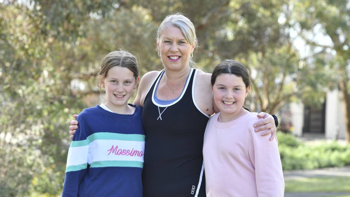 FAMILY AFFAIR: Justine's children play a major role in her training program. Picture: NONI HYETT 