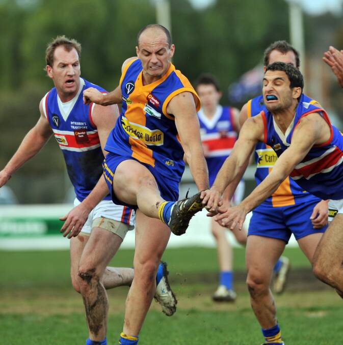 Golden Square defender Aaron Hawkins clears the ball against Gisborne in round 8, 2008. 