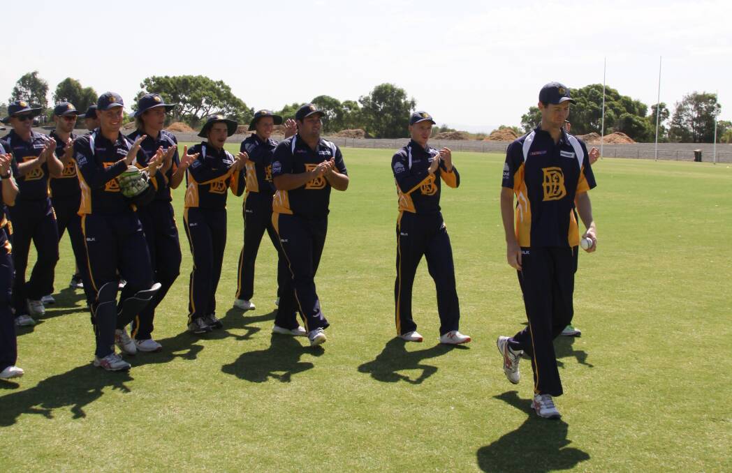 Scott Trollope leads the BDCA team off the field after his six-wicket haul. Picture: TRAVIS HARLING