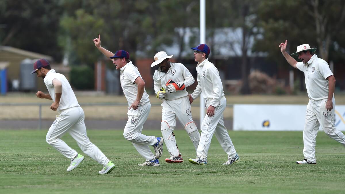 Sandhurst players celebrate a wicket against Huntly-North Epsom. Picture: GLENN DANIELS