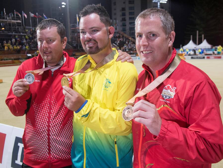 Bendigo's Aaron Wilson with his Commonwealth Games medal alongside Ryan Bester (silver) and Robert Paxton (gold).