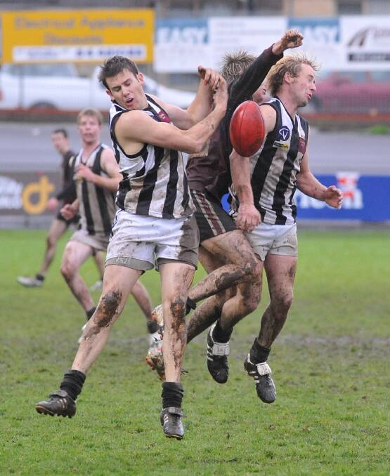 Action from Castlemaine's win over Sandhurst in the wet.