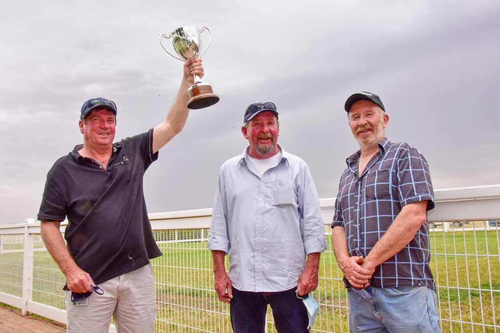 JUBILANT: Brendon Hearps, middle, with some of the owners of Vungers. Picture: RACING PHOTOS