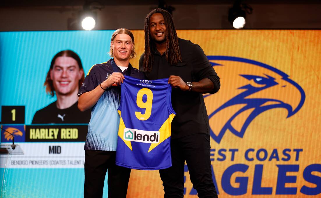 AFL Draft number one pick Harley Reid receives his first West Coast Eagles jumper from club great Nic Naitanui. Picture by Getty Images