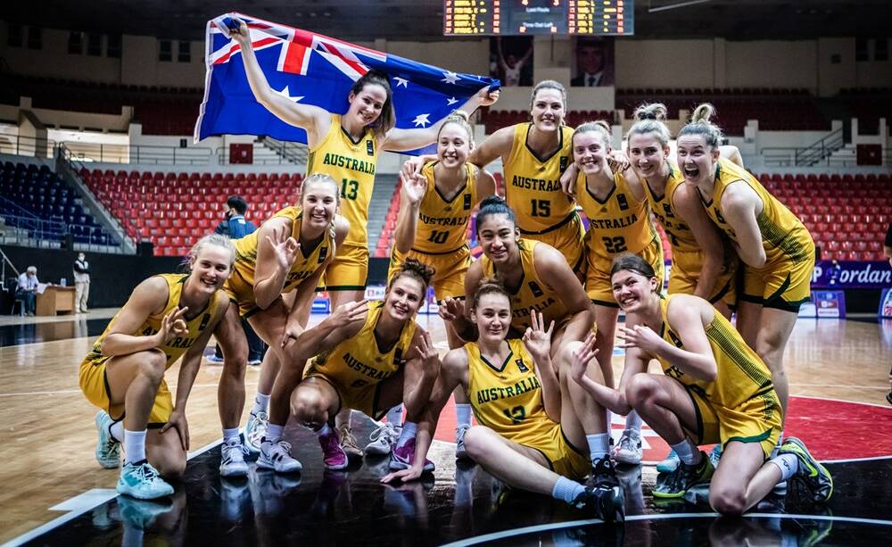 ALL SMILES: The Opals celebrate their bronze medal at the Asia Cup in Jordan. Picture: FIBA