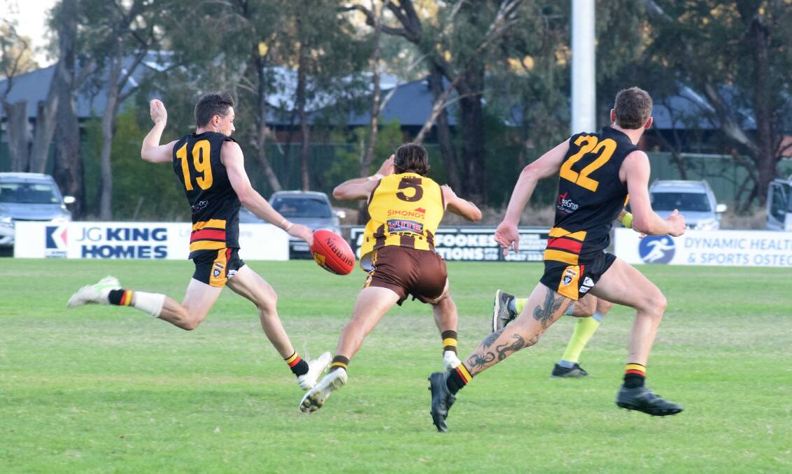 ON THE RUN: Leitchville-Gunbower's Tom Brereton bursts off half-back in Saturday's one-point win over Huntly. Picture: KIERAN ILES