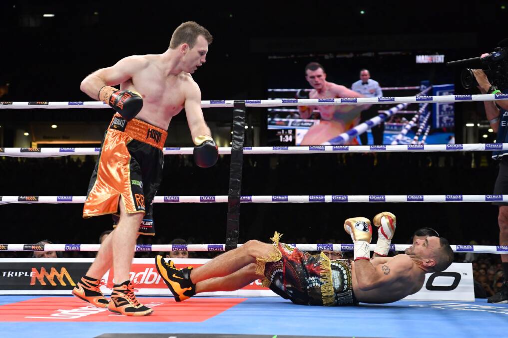 Jeff Horn puts Anthony Mundine to the canvas.