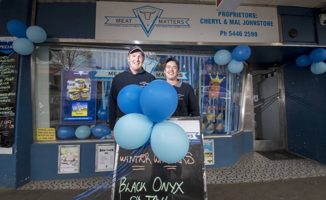 GO HAWKS: Matt Jeffries and Lachie Brook from Meat Matters in Eaglehawk show their support for the Borough. Pictures: DARREN HOWE 
