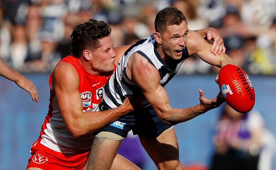 Joel Selwood fires out a handball in the first quarter of the grand final. Picture by Getty Images