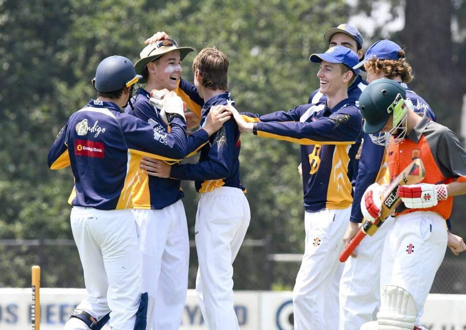 HAIL THE CHIEF: Nick Wallace is congratulated by his BDCA under-17 team-mates after a run out against Goulburn Murray on Tuesday. Picture: NONI HYETT