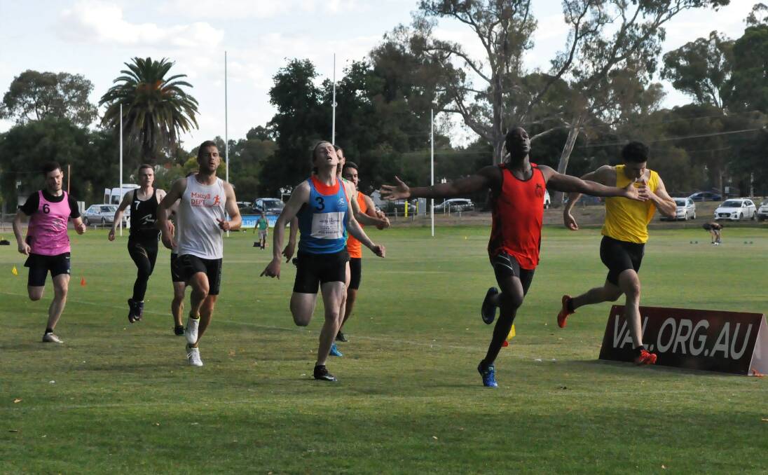 TRIUMPH: Munashe Hove celebrates victory in the open 400m at Camp Reserve in Castlemaine. Pictures: GREG HILSON