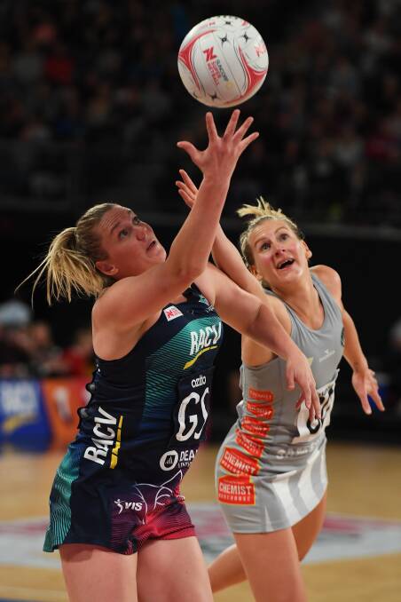 Caitlin Thwaites catches the ball ahead of Collingwood's April Bradley in Monday's Super Netball clash.