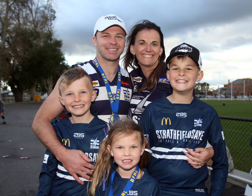 Shannon Geary with his family after the Storm's victory. Picture: GLENN DANIELS