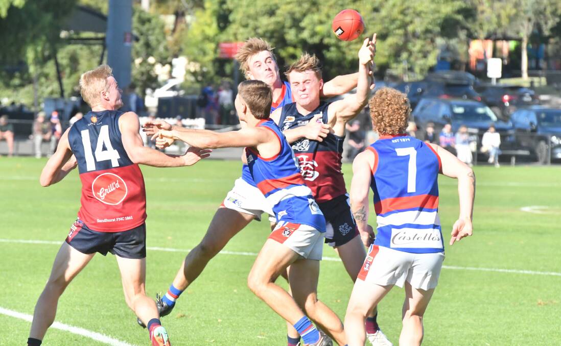 Sandhurst's Cobi Maxted and Gisborne's Zac Denahy compete for the ball in Saturday's big game at the QEO. Picture by Adam Bourke