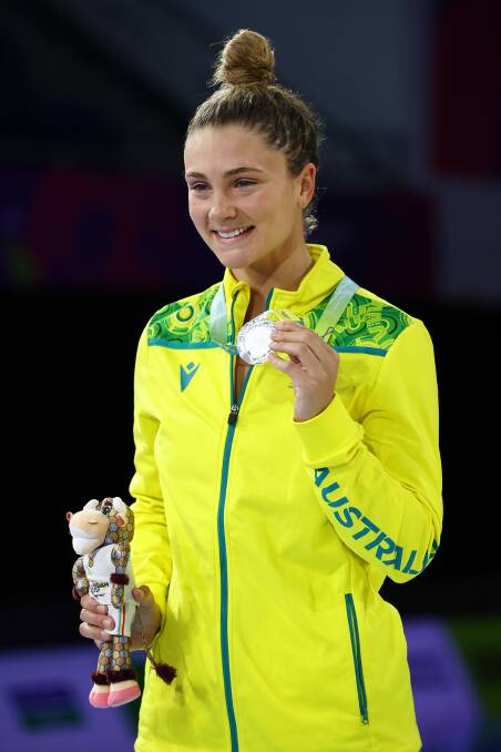 ALL SMILES: Jenna Strauch after receiving her silver medal in Birmingham. Picture: GETTY IMAGES