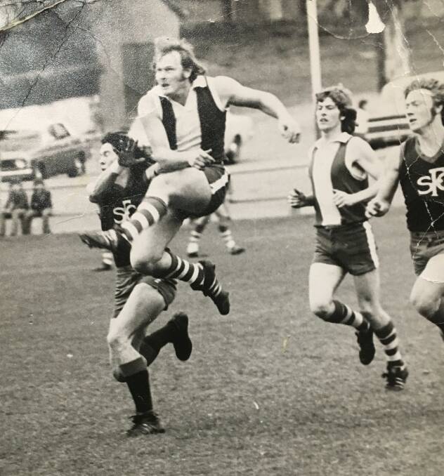 BLOODS' STAR: Peter Hutcheson in full flight for South Bendigo against Sandhurst in 1974. Picture: CONTRIBUTED