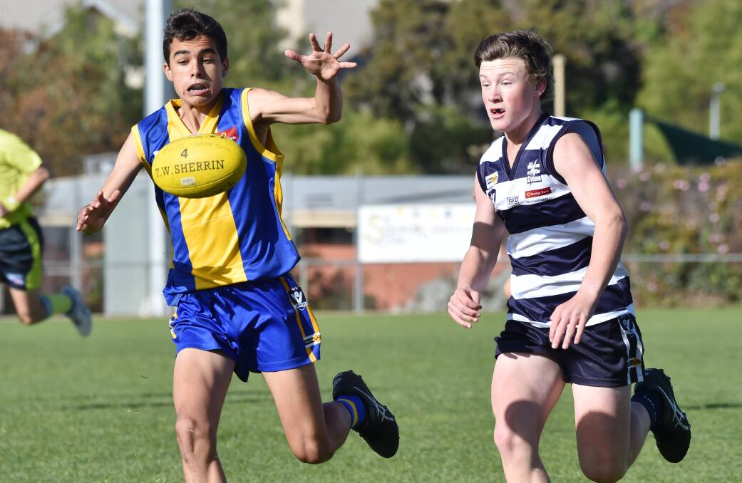 Golden Square's Harrison Kelly leads the race for the ball in the under-14 senior clash with Strathfieldsaye. Picture: DARREN HOWE
