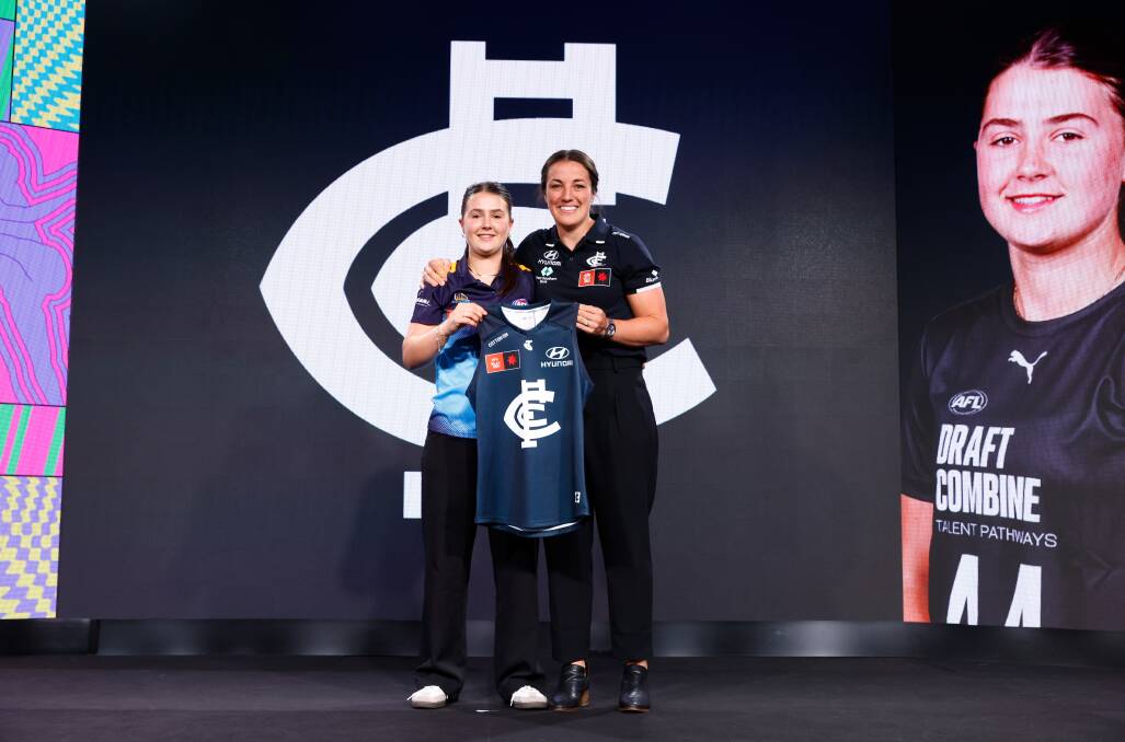 Lila Keck is presented with her Carlton jumper by Kerryn Peterson at the AFLW Draft. Picture by Getty Images