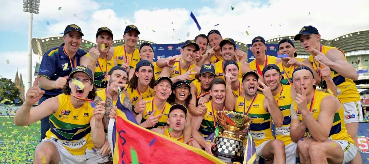 Kobe Mutch, far right of front row, with his Woodville-West Torrens team-mates after their SANFL grand final win. Picture: SANFL
