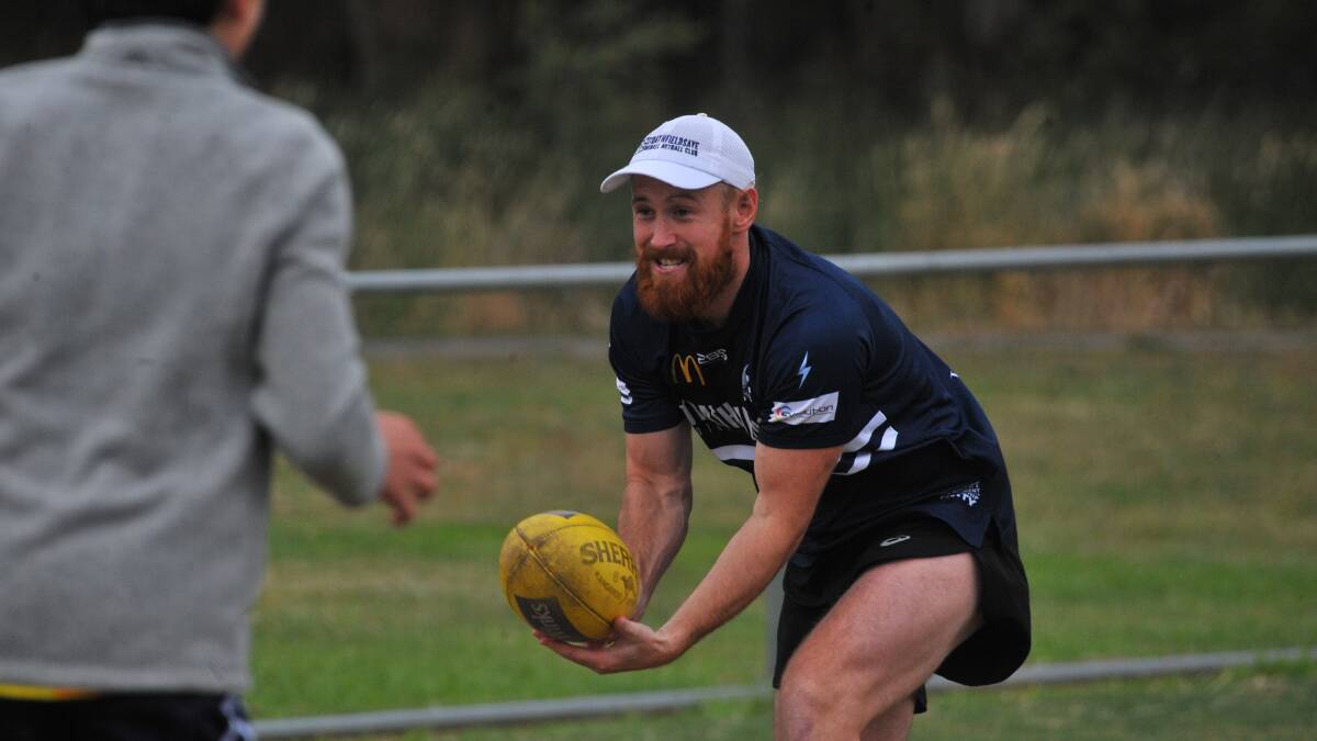 LEFT AND RIGHT: Strathfieldsaye Storm Lachlan works on his handballing at Storm training before the season was postponed.