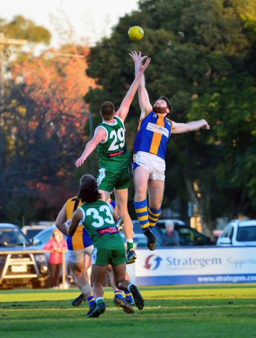 BIG BOYS FLY: Kangaroo Flat's William Copeland and Golden Square's Matt Compston do battle in the ruck. Picture: BRENDAN McCARTHY