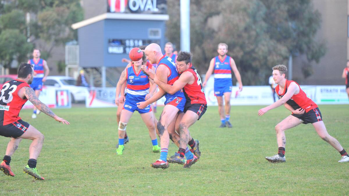 North Bendigo's Tyson Findlay is wrapped up in a tackle. Picture: ADAM BOURKE