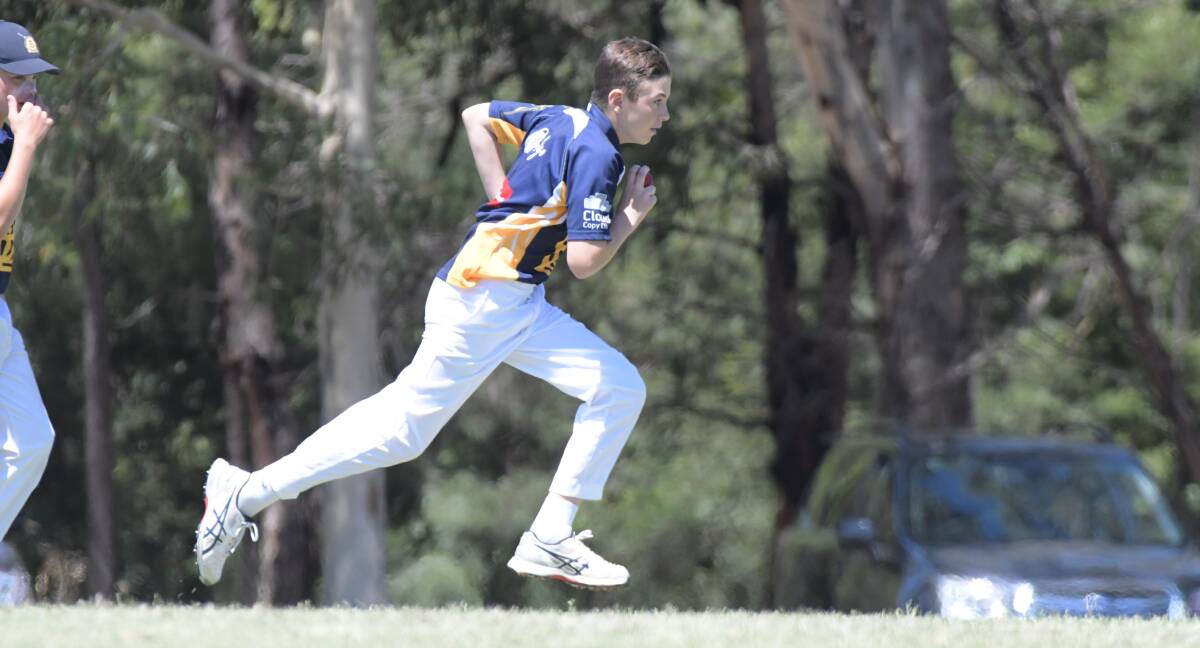 Charlie Edwards charging into bowl for the BDCA under-14 cricket team in 2019.