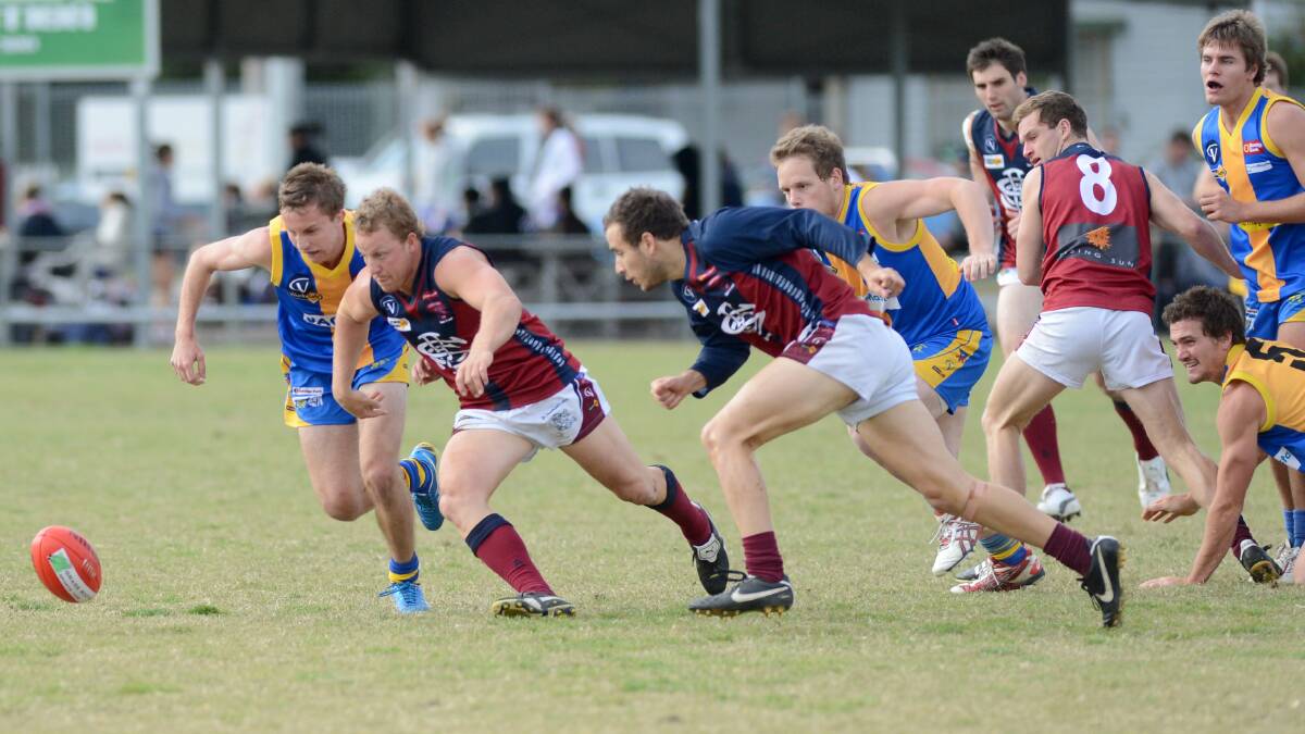 Sandhurst's Blair Holmes leads the race for the ball in the Dragons' win over Golden Square.