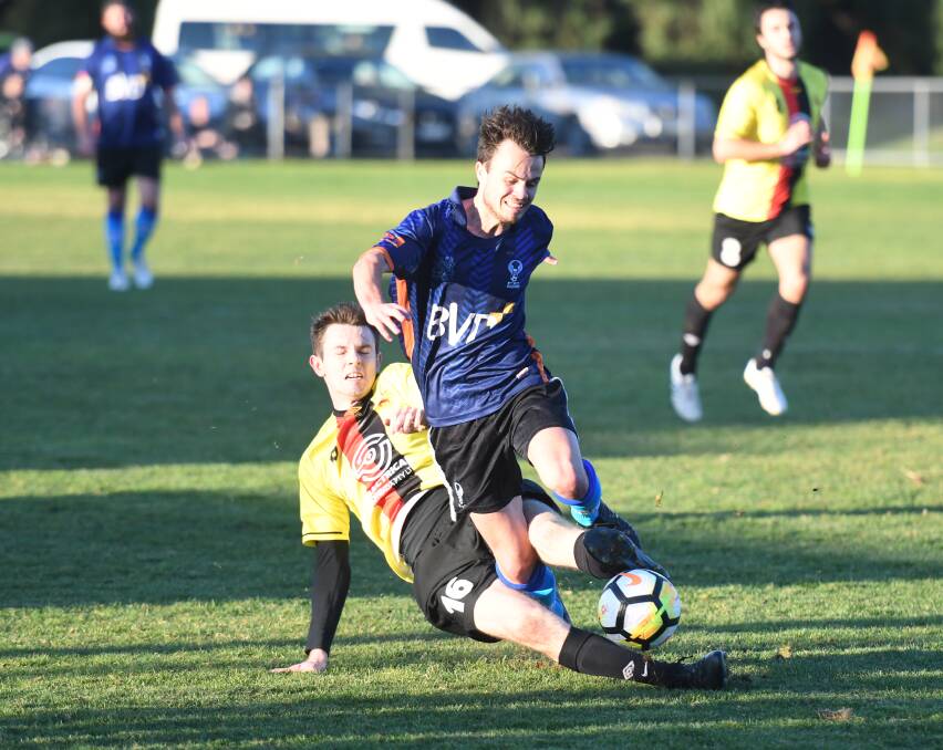 Eaglehawk's Riley Hayton is tackled from behind against Shepparton. Picture: ADAM BOURKE