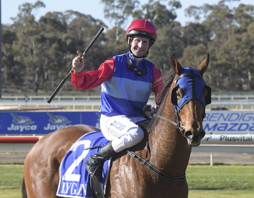 JUBILANT: Brad Rawiller returns to the mounting yard after winning on Star Hills. Picture: NONI HYETT