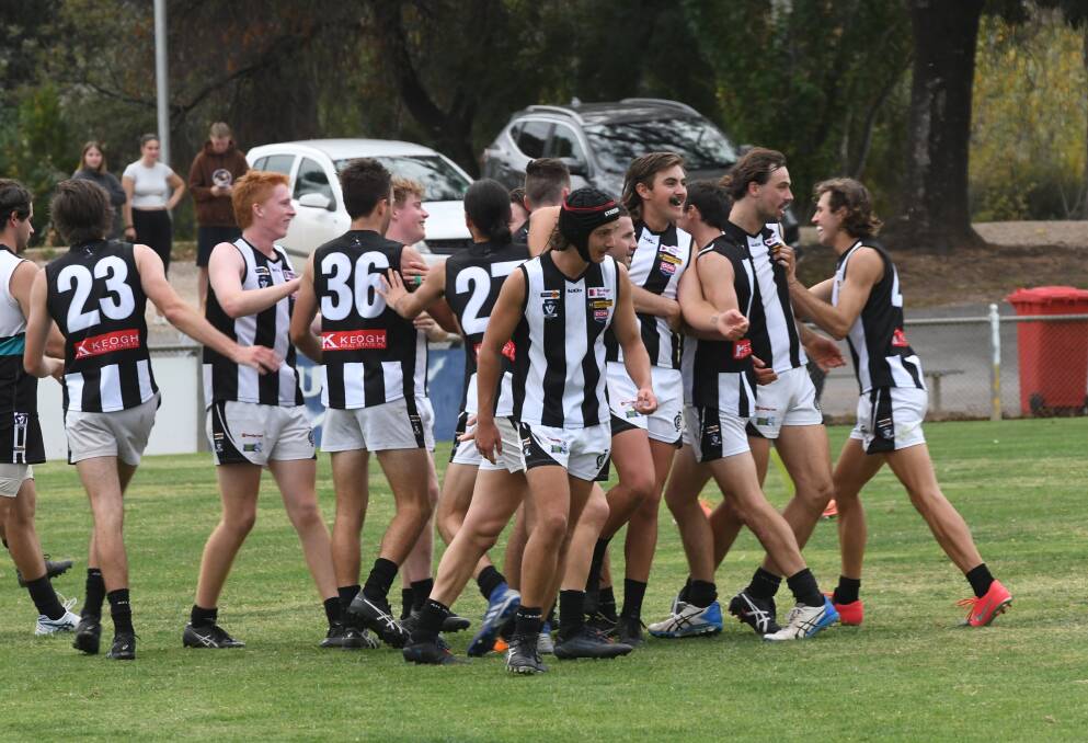Castlemaine players celebrate a final-term goal in their win over Maryborough. Picture: ANTHONY PINDA