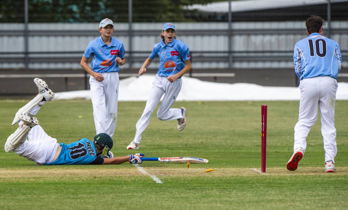 GOT HIM: Strathdale players celebrate the run out of Huntly-North Epsom's Lachlan Wilson in the under-16 T20 grand final at the QEO. Picture: DARREN HOWE