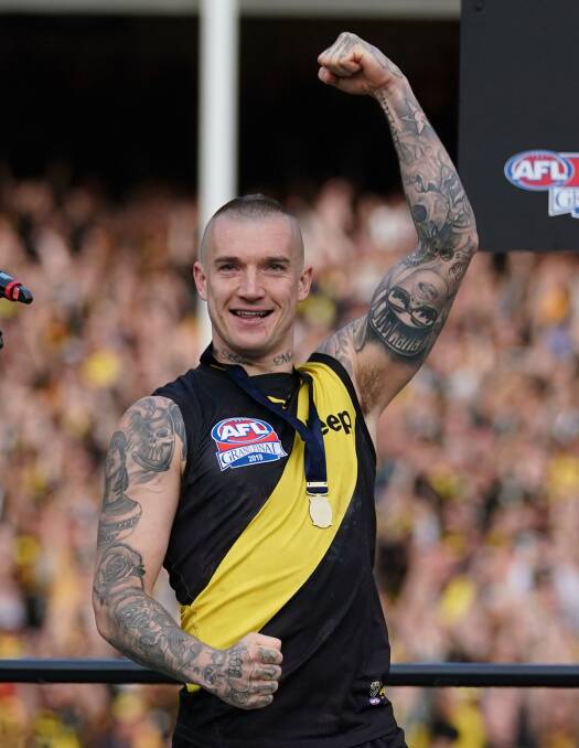 Dustin Martin after receiving his premiership medal. Picture: THE AGE