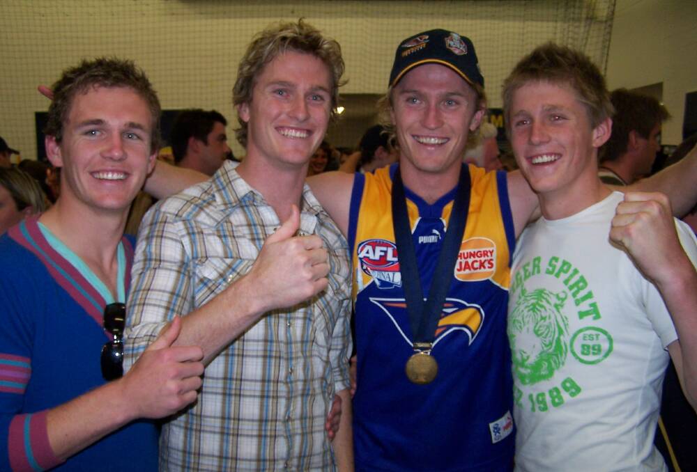 Joel, Troy, Adam and Scott Selwood after West Coast's 2006 premiership win.