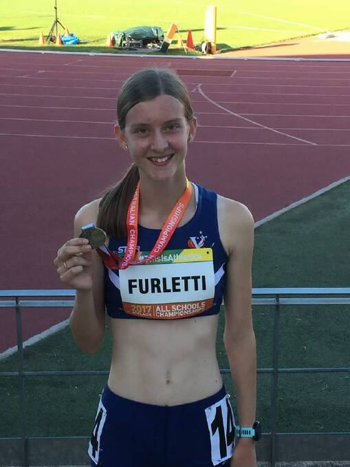 STEEPLE STAR: Taryn Furletti with her gold medal.